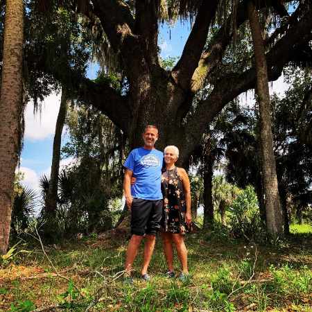 Arlyn Phoenix with her husband Jeffrey Weisberg at their wedding venue.